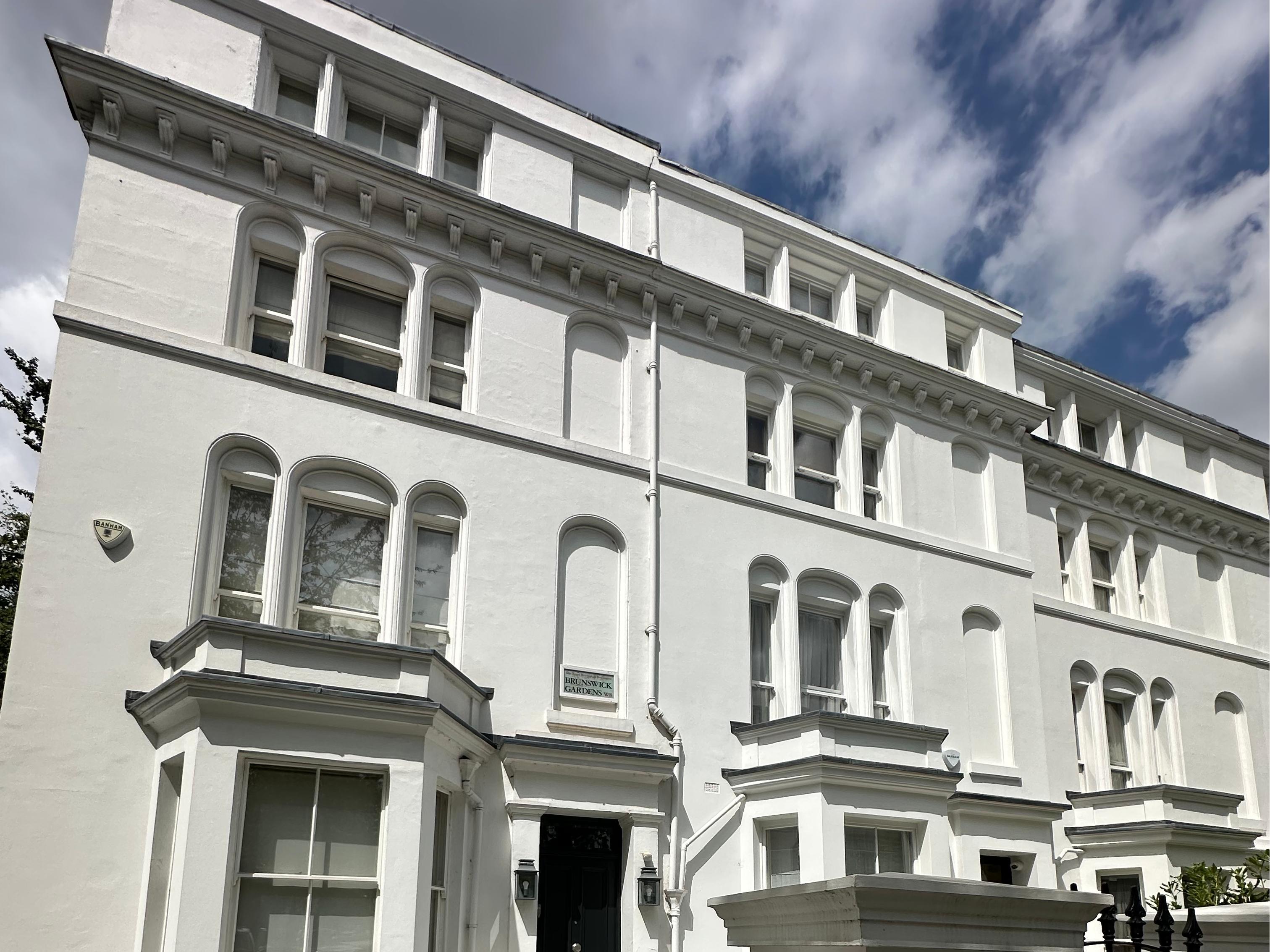 How do the climatic differences in different regions of the UK specifically affect property selection?