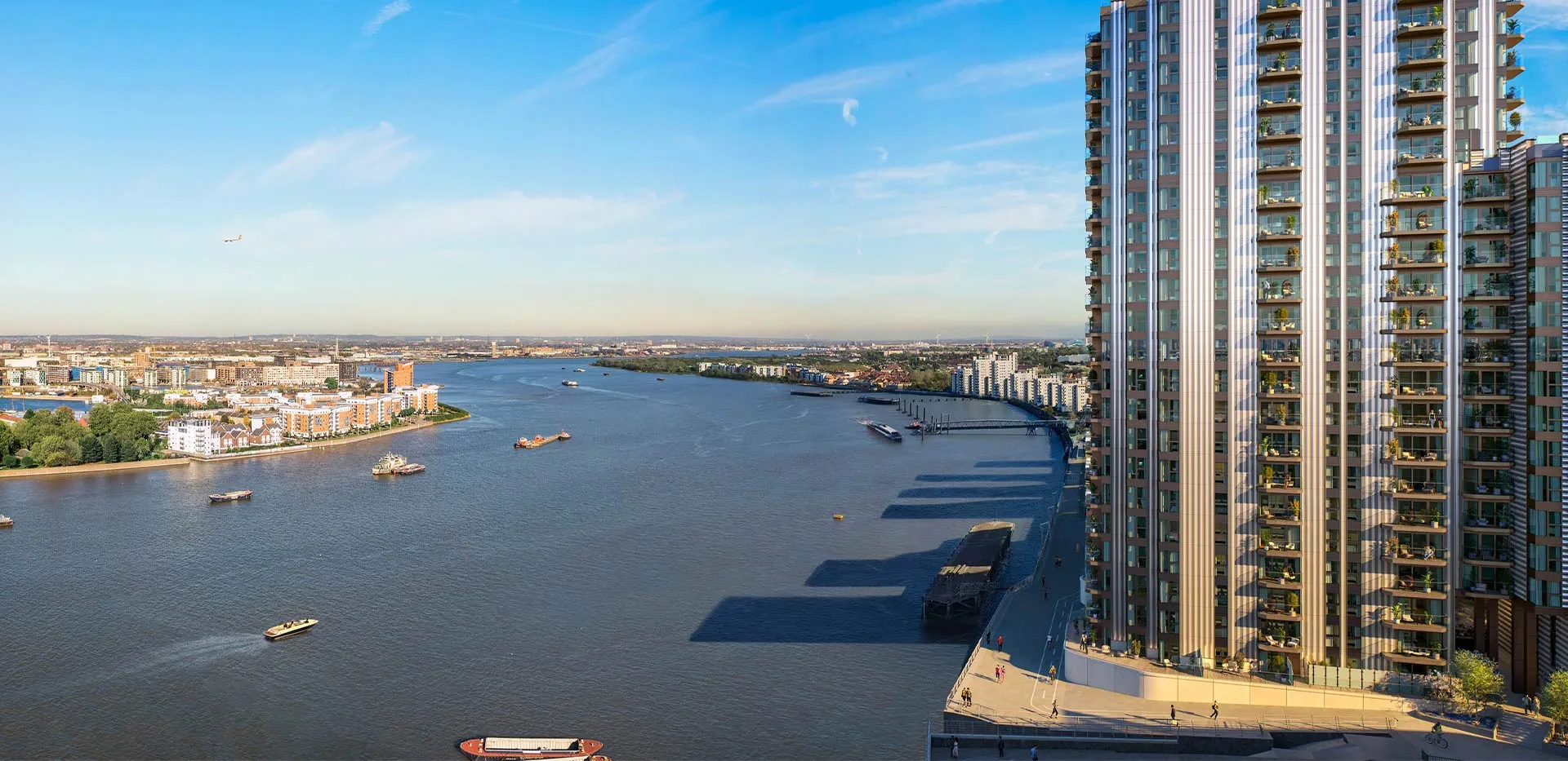 Contemporary high-rise residential building situated along the scenic River Thames in London.
