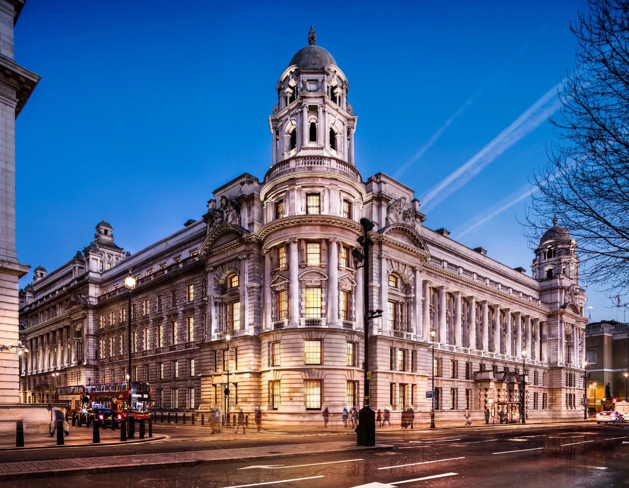 Stunning night view of The OWO facade, brilliantly illuminated with city life below in London.